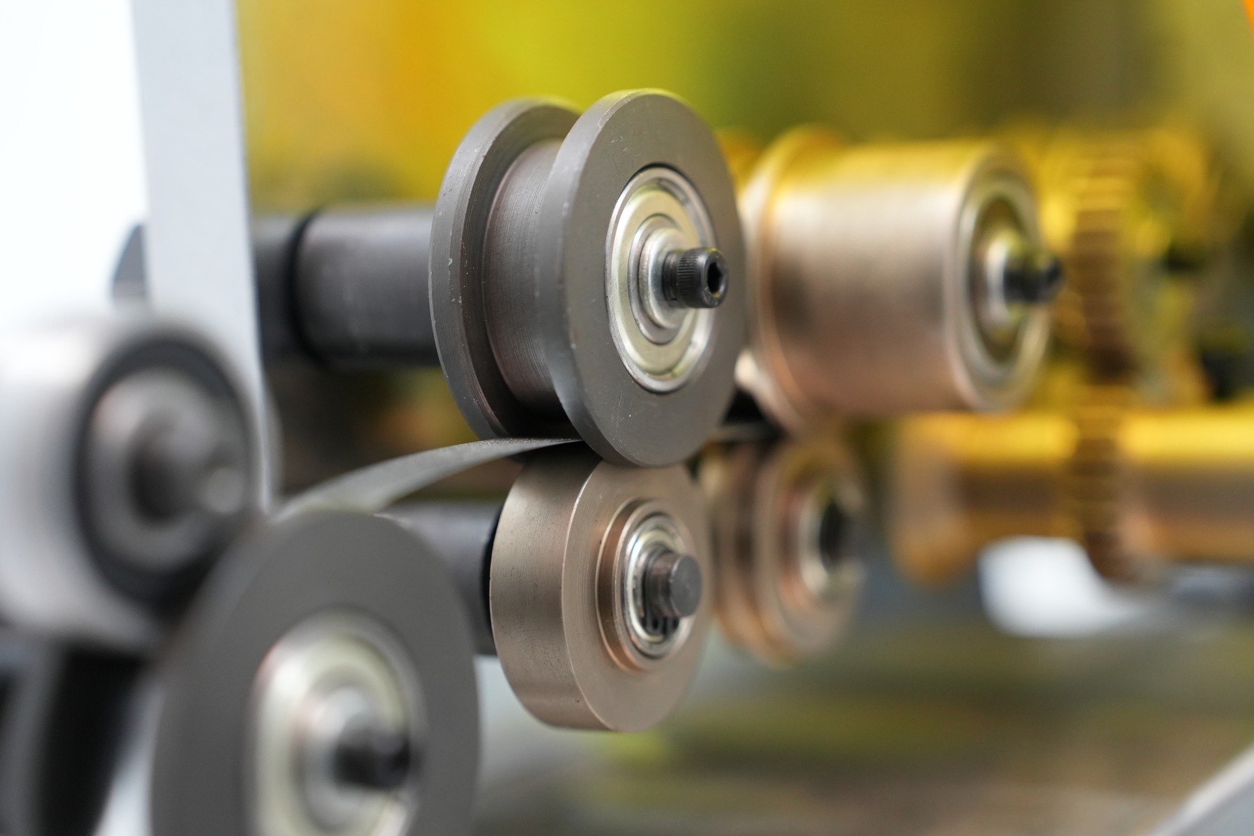 Close-up of metal rollers in industrial machinery